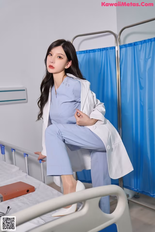 a woman sitting on top of a hospital bed
